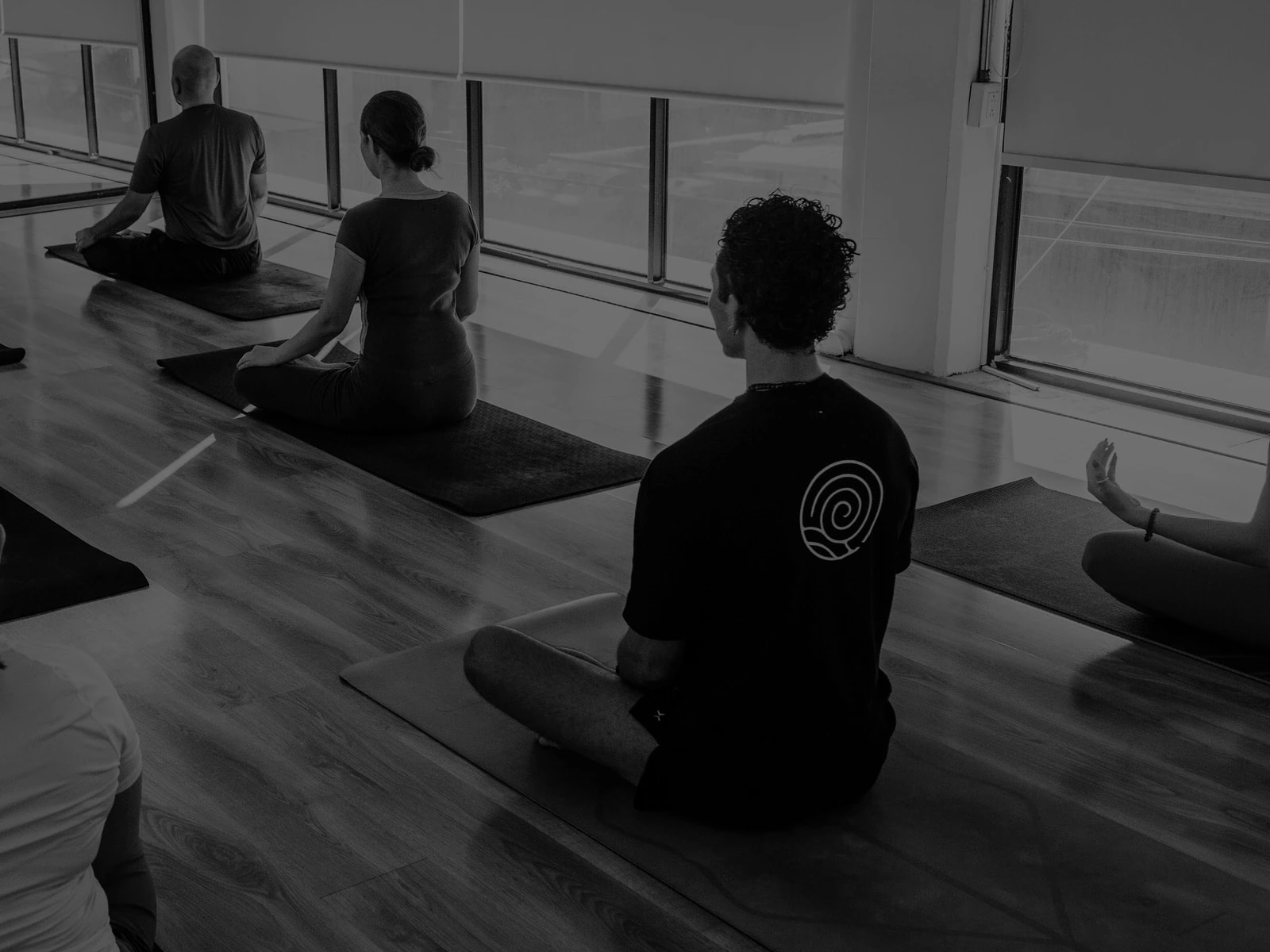 A group in guided practice inside the studio