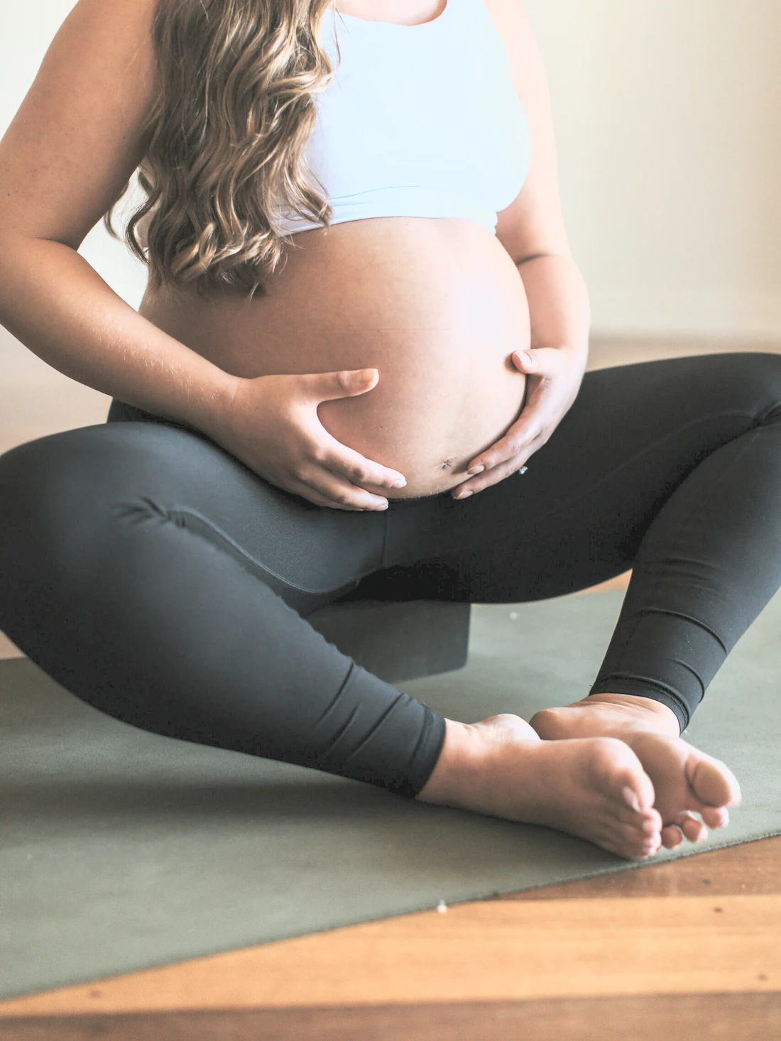 Pregnant woman in a gentle yoga posture